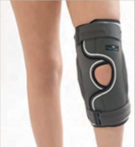 Genouillere avec charniere de stabilisation